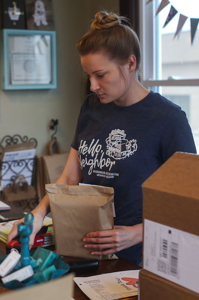 Sami Martin helps package a curbside